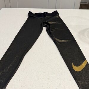 Nike Women’s Leggings in Black with Gold Swoosh